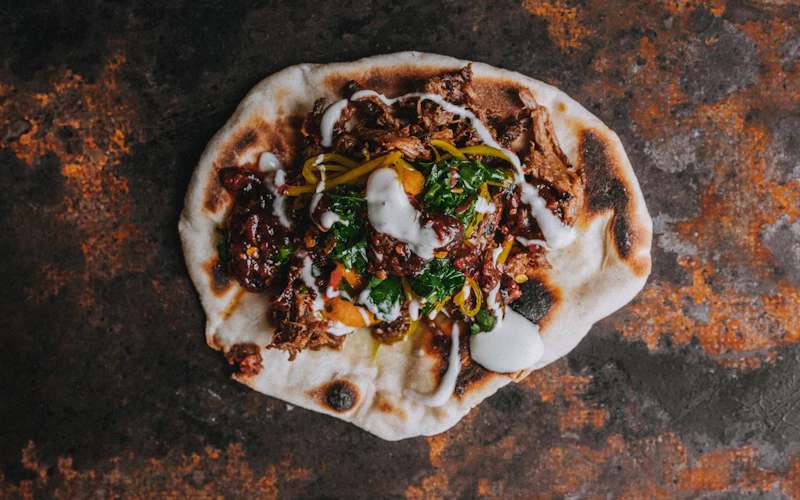 Tender and aromatic with a satisfying depth of flavour, this Smoked Beef Naan — provided by Tom Griffith of Flank fame — is so worth the effort.