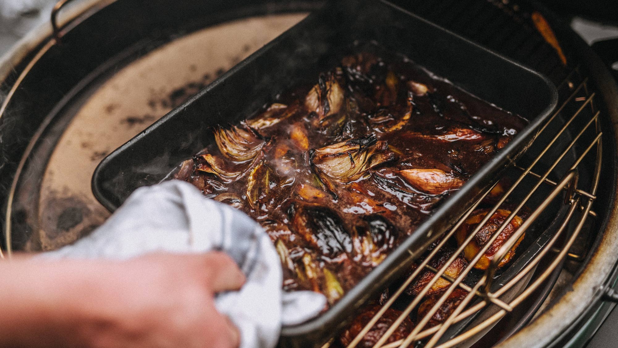 Rectangular drip pan with roasted sirloin of beef and red wine gravy