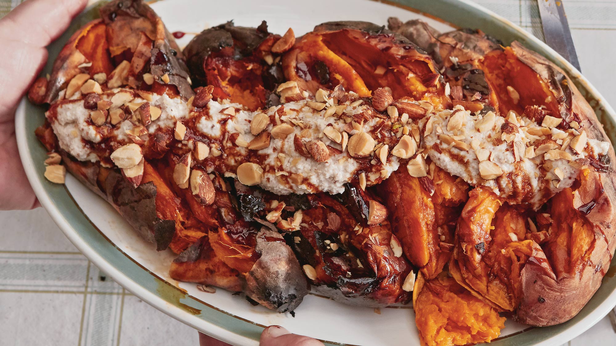 Dirty Sweet potatoes, with almond tahini and smoked almonds | Dirty cooking | Vegetarian Recipes | Honey & Co Chasing smoke cooking over fire around the levant | Big Green Egg