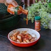 In 1974, when Big Green Egg’s founder Ed Fisher started selling kamado-style ovens from his small store in Atlanta, Georgia, he lured customers in by cooking up mouthwatering chicken wings out on the street.